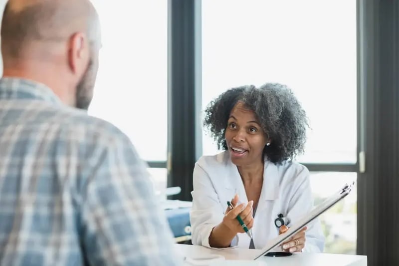 Female healthcare professional conducting a session with adult student