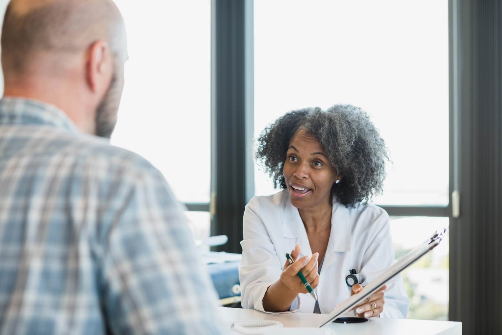 female healthcare professional conducting a session with adult student